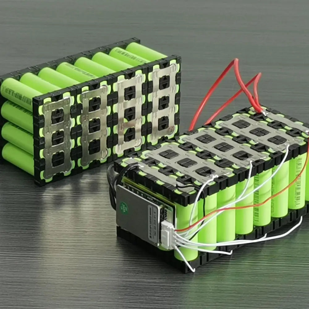 Assorted lithium-ion batteries with attached battery management systems, showing specialization in 12v, 24v, 36v, 48v, and high voltage options for customization.