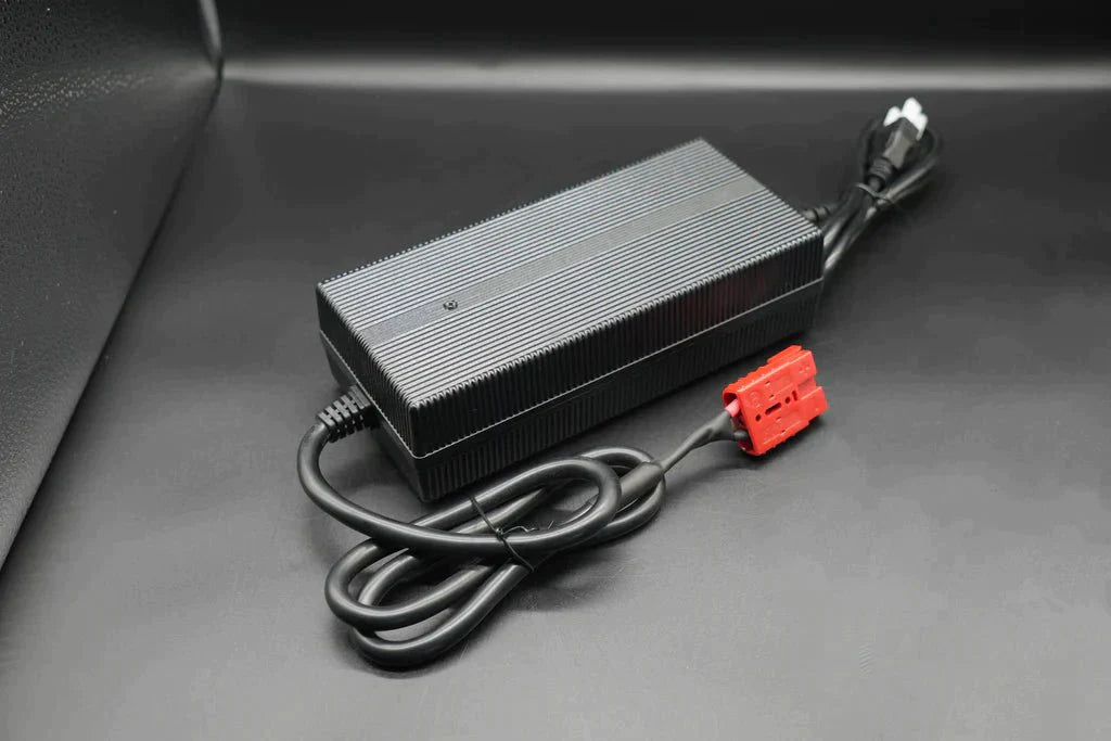 Black car using 12V lithium charger with red power cord for efficient charging.