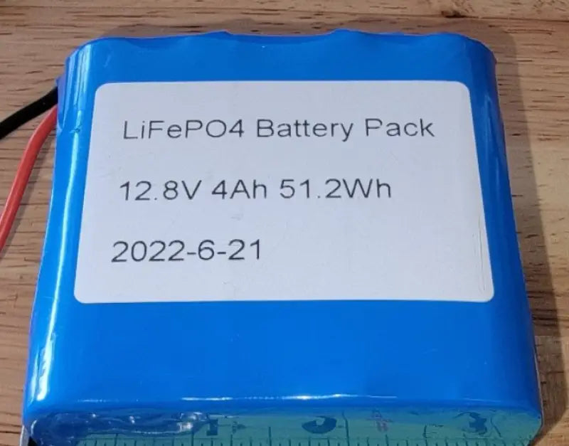 12V 4AH lithium PVC wrap battery with white label on display