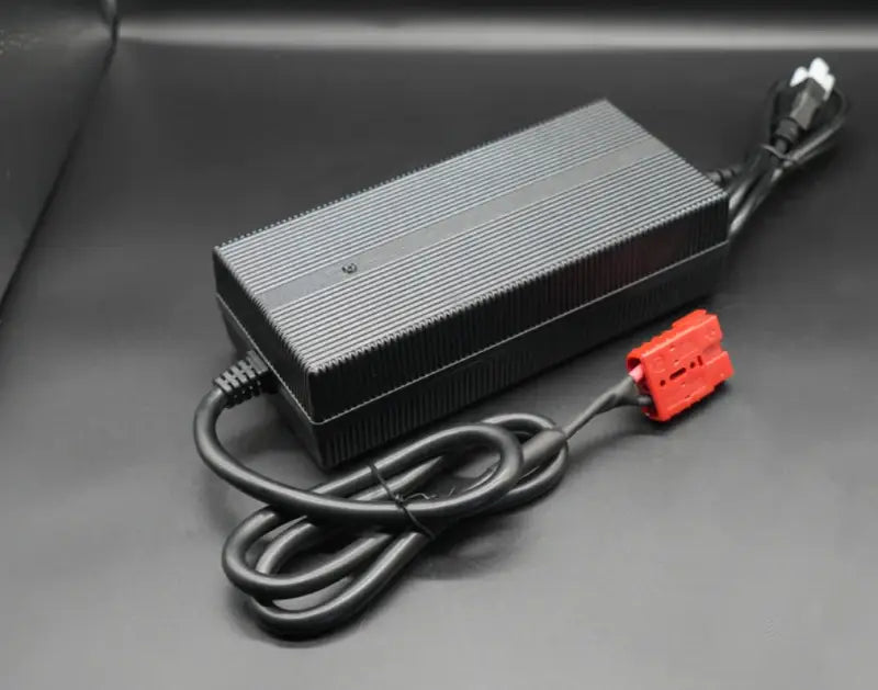 Black 12V 4A lithium ion charger with red power cord.