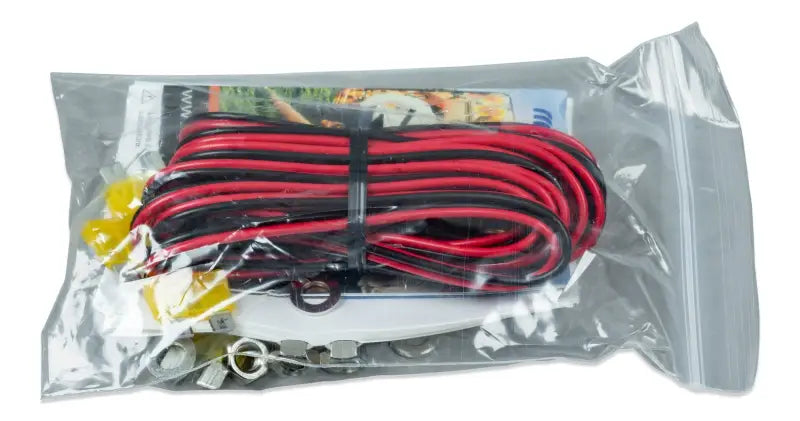 Phoenix charger showcasing red and black cable with white cord for stage charging process