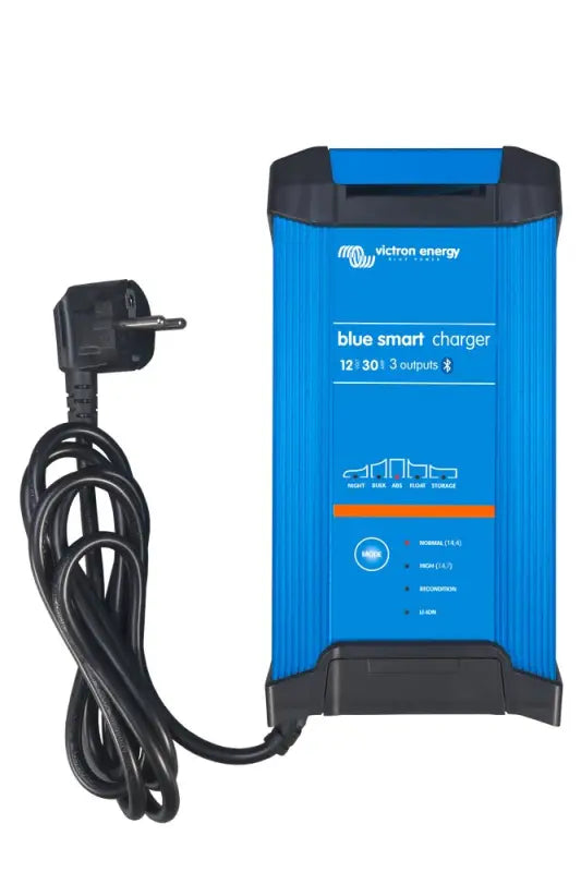 Blue Smart IP22 Charger plugged into power cord, showcasing its sleek design.