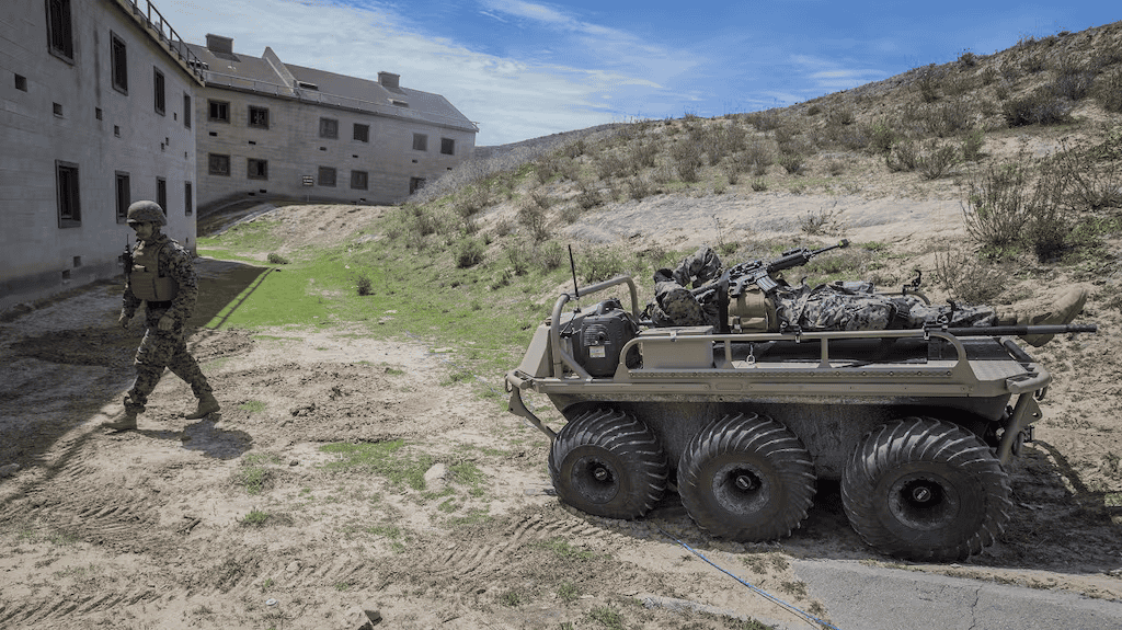 General Dynamics MUTT unmanned ground vehicle powered by Lithium Battery Company 48V 100Ah LiFePO4 batteries in military field operation.